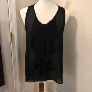 Sleeveless blouse with bow